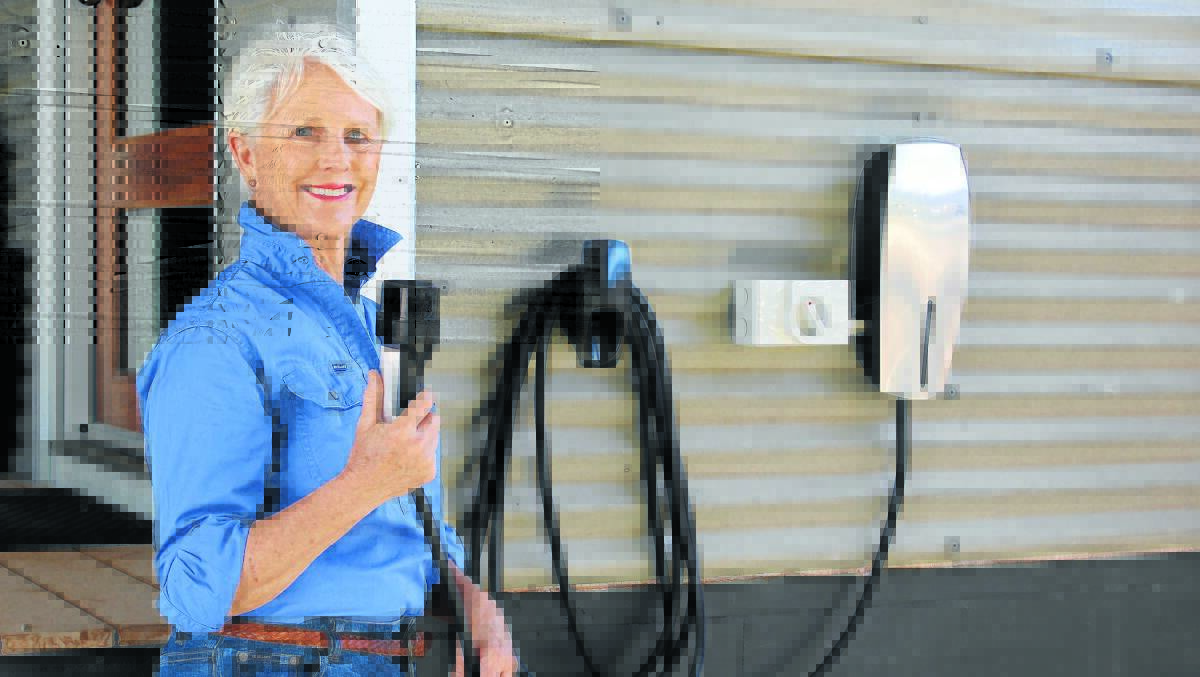 Wendy Muffet at Girragirra Retreat with the newly-installed electric car charging station. She says Forbes is ideally situated for a larger, supercharger station which would bring visitors into town. 1115chargingstation(5)