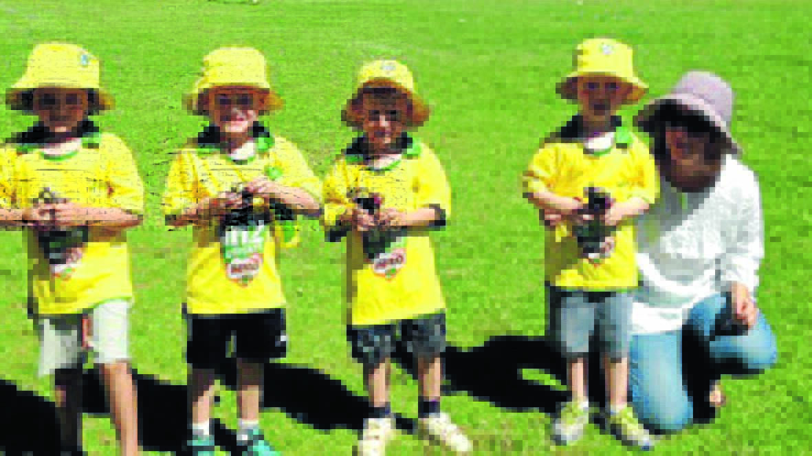 Milo cricket award winners last weekend (l-r) Max Hazell, Lachlan Wallace, ­Isaiah Klinger and Ethan Ray, with Laurinda Ray. 