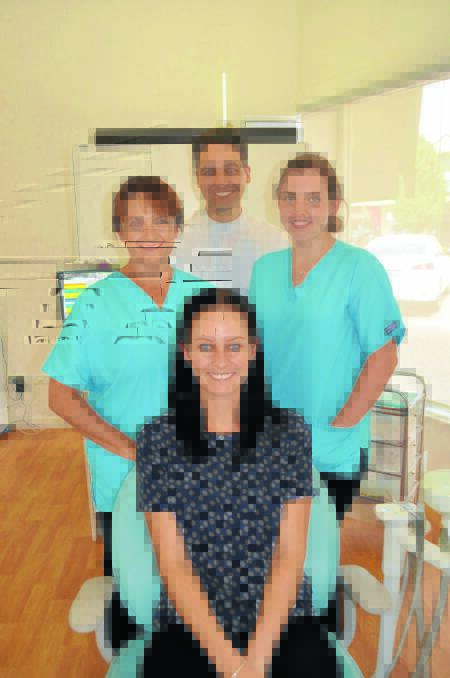 The team from Forbes Family Dentists including (front) Teagan Reeves, (l-r) Michelle Gallagher, Daniel Demosthenous, and Jess Aerts. 0315dentists