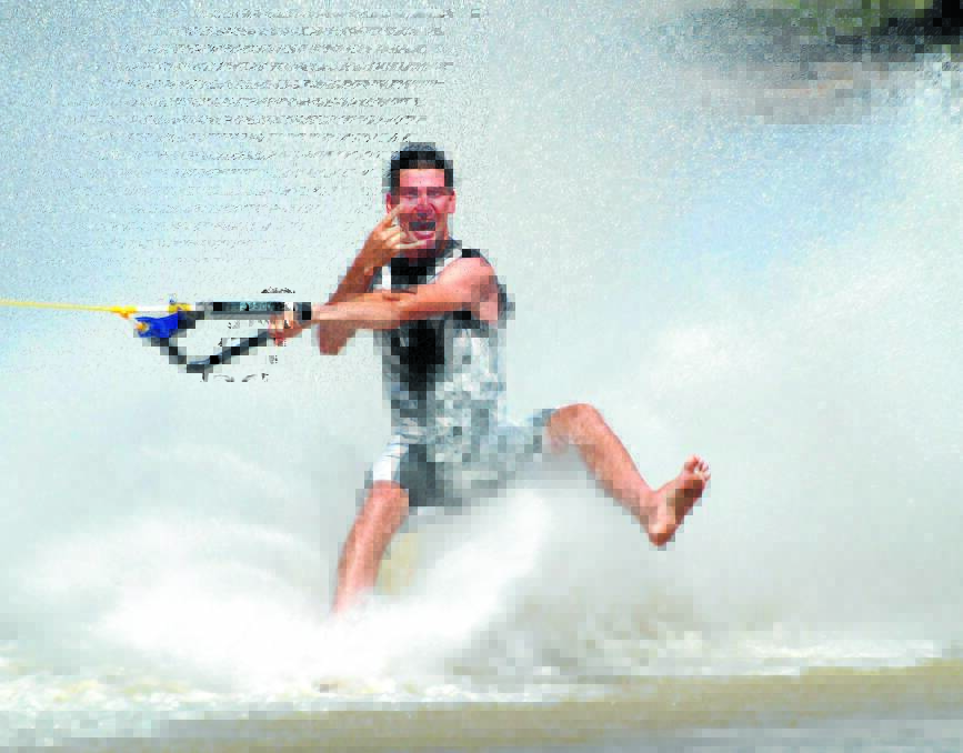 Barefoot trick champion Brenton Crouch in action. He visited Forbes with his water ski team Liquid Malisha as part of a tour of central NSW in 2011.