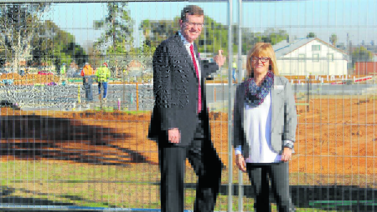 On site at the Barton Street development is member for Orange Andrew Gee with Forbes Preschool director Amy Shine.
