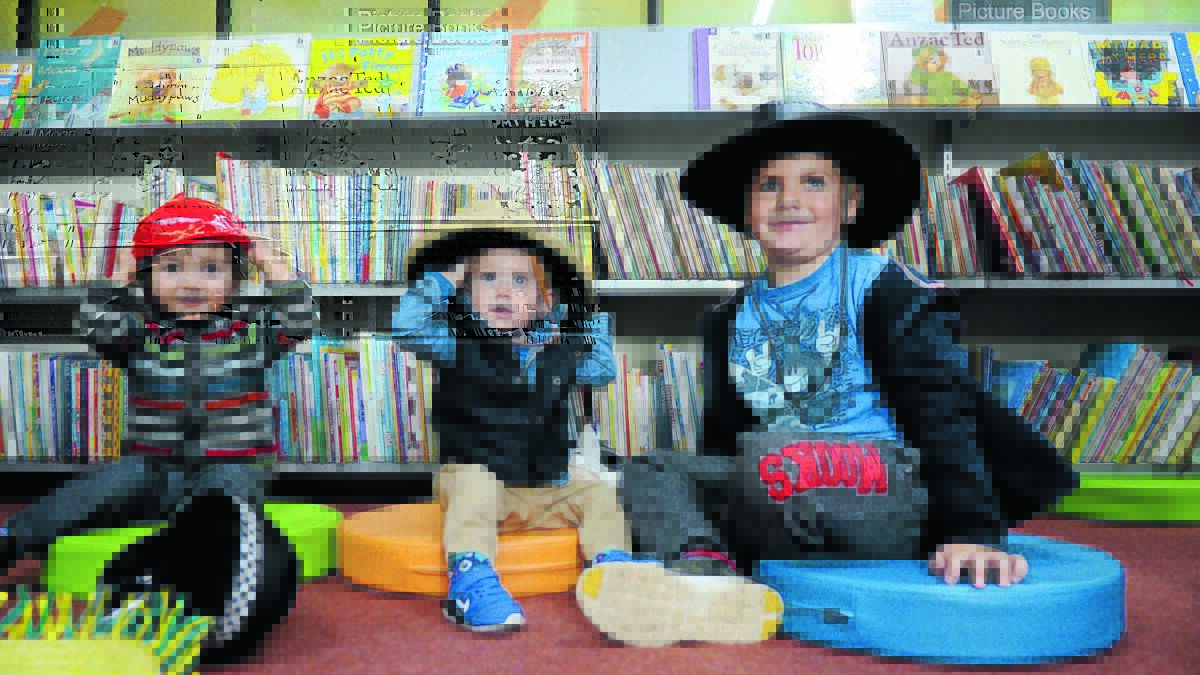 Happy in their hats … Harvey Bruem, Jed Maitland and Billy Smith. Billy (5) is a regular at Forbes library and brought 14-month-old Jed in to borrow a book. 
