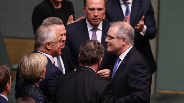 Treasurer Scott Morrison is congratulated by Prime Minister Malcolm Turnbull after he gave the budget address on Tuesday. Photo: Andrew Meares