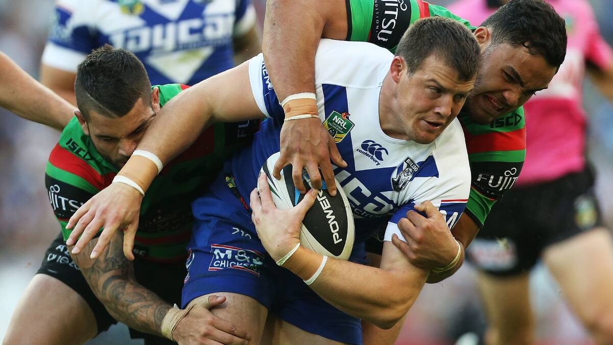 Josh Morris of the Bulldogs is tackled during the round seven NRL match between the South Sydney Rabbitohs and the Canterbury-Bankstown Bulldogs at ANZ Stadium on April 18, 2014 in Sydney, Australia. (Photo: Mark Metcalfe/Getty Images.