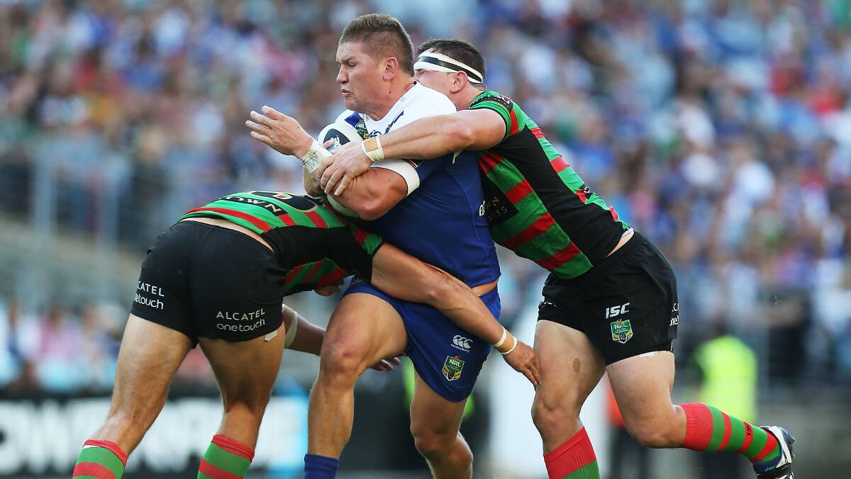  Greg Eastwood of the Bulldogs is tackled during the round seven NRL match between the South Sydney Rabbitohs and the Canterbury-Bankstown Bulldogs at ANZ Stadium on April 18, 2014 in Sydney, Australia. Photo: Mark Metcalfe/Getty Images.