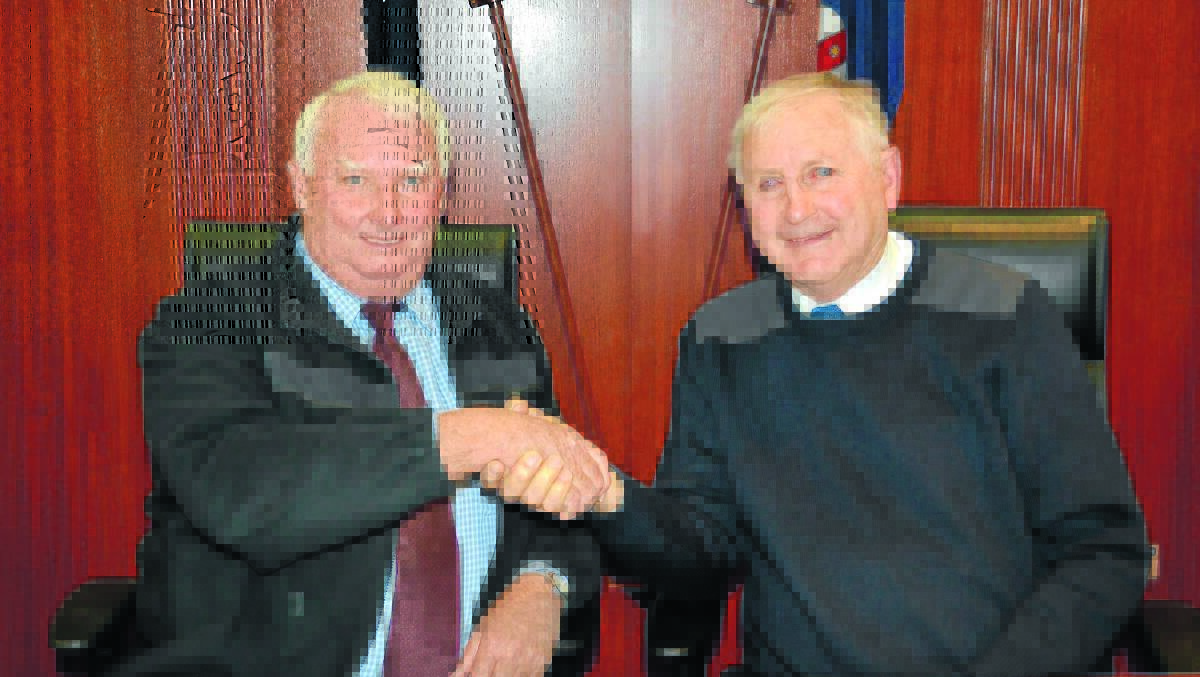 Deputy mayor Graeme Miller and mayor Ron Penny after being re-elected at Monday's meeting.
