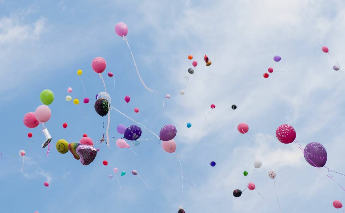 Attendees of Lizzy Knox's funeral released balloons after the service. 