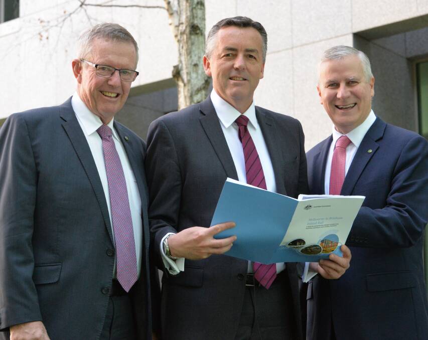 Federal Member for Parkes Mark Coulton, Transport Minister Darren Chester and Riverina Member Michael McCormack discuss the opening of Inland Rail tenders.