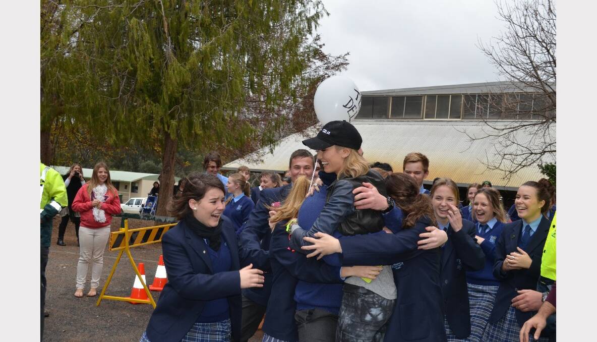 Hundreds of fans turned out to welcome The Voice grand finalist Celia Pavey and her coach Delta Goodrem to Forbes during a special visit on Friday. 