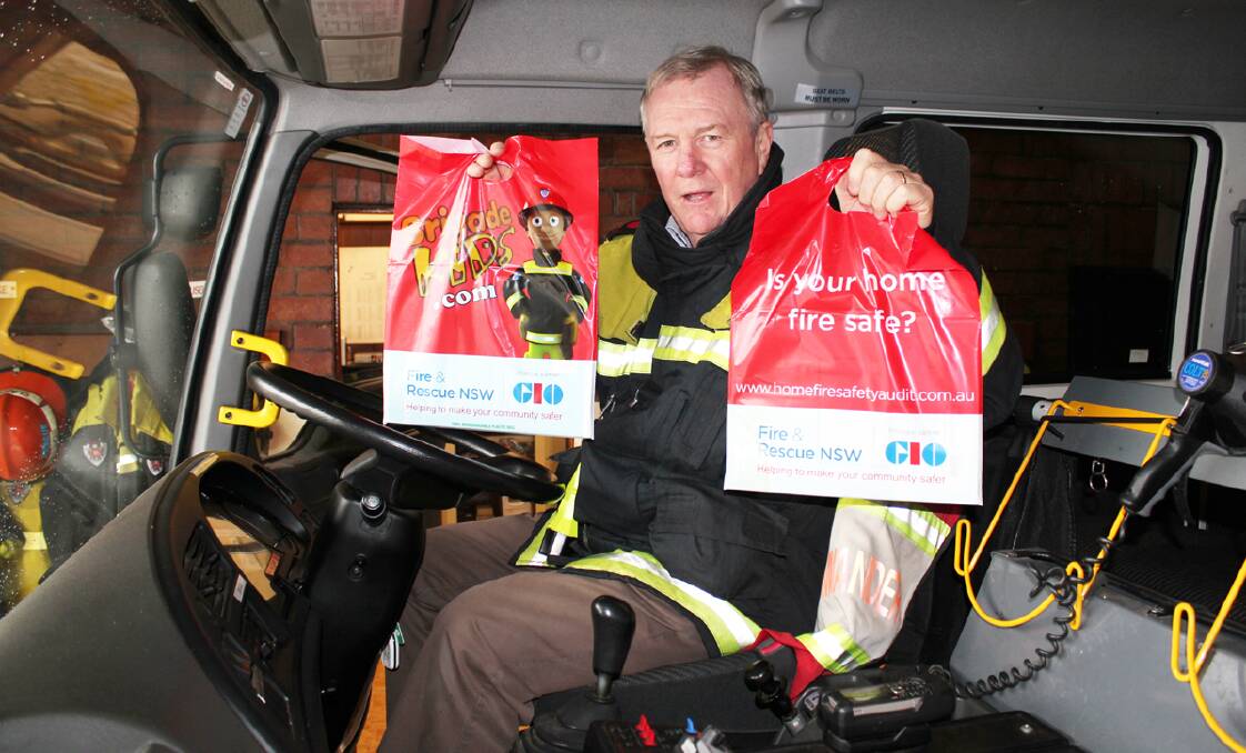 Station Commander for Forbes Fire and Rescue Brian Clarke with some of the sample bags available for children during the open day.