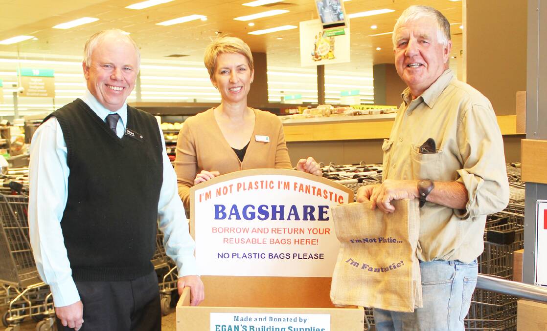 Store manager of Woolworths Forbes Robert Harris, Centacare’s ­community liaison officer with the Community Mates program Toni Hanns and member of the Forbes Environmentally Concerned Community Group Pip Perry with one of the Bag Share Bins now available.