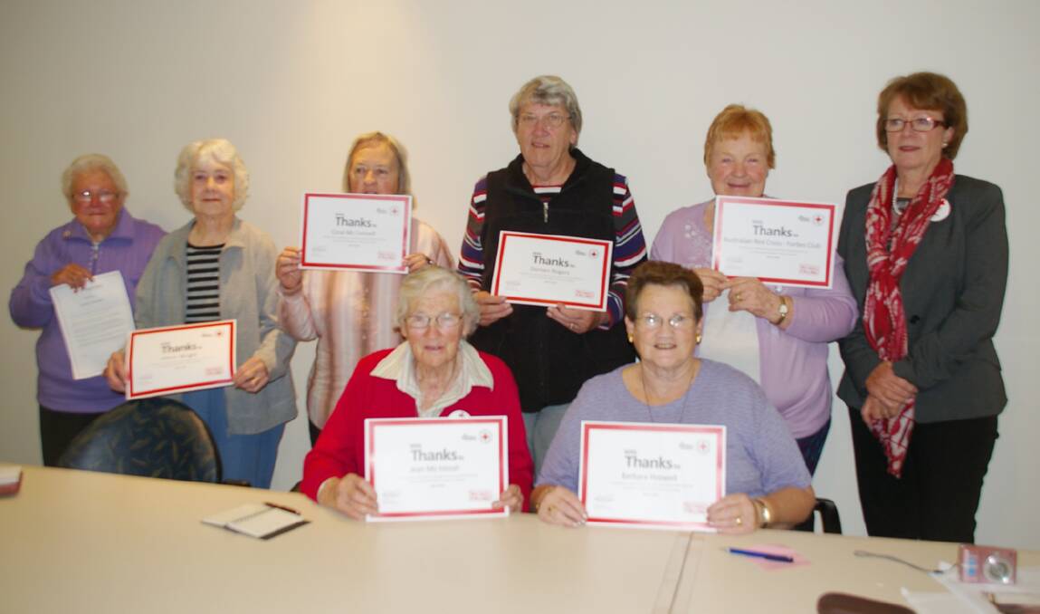 Red Cross Forbes volunteers (standing l-r) Gladys Brenner, Gloria Wright, Coral McConnell, Doreen Rogers, Wilma Hepburn, and (front) Jean McIntosh and Barbara Hoswell received certificates from Sue Strahorn (right) at the recent meeting, in  recognition of their contribution to Red Cross Calling.