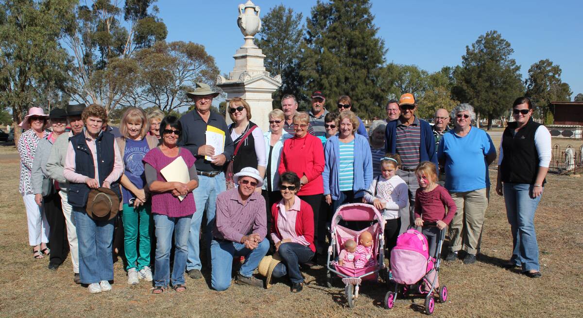 Tour leader Keith Rawsthorne (centre) with his group ahead of Sunday’s afternoon tour of the Forbes Cemetery.