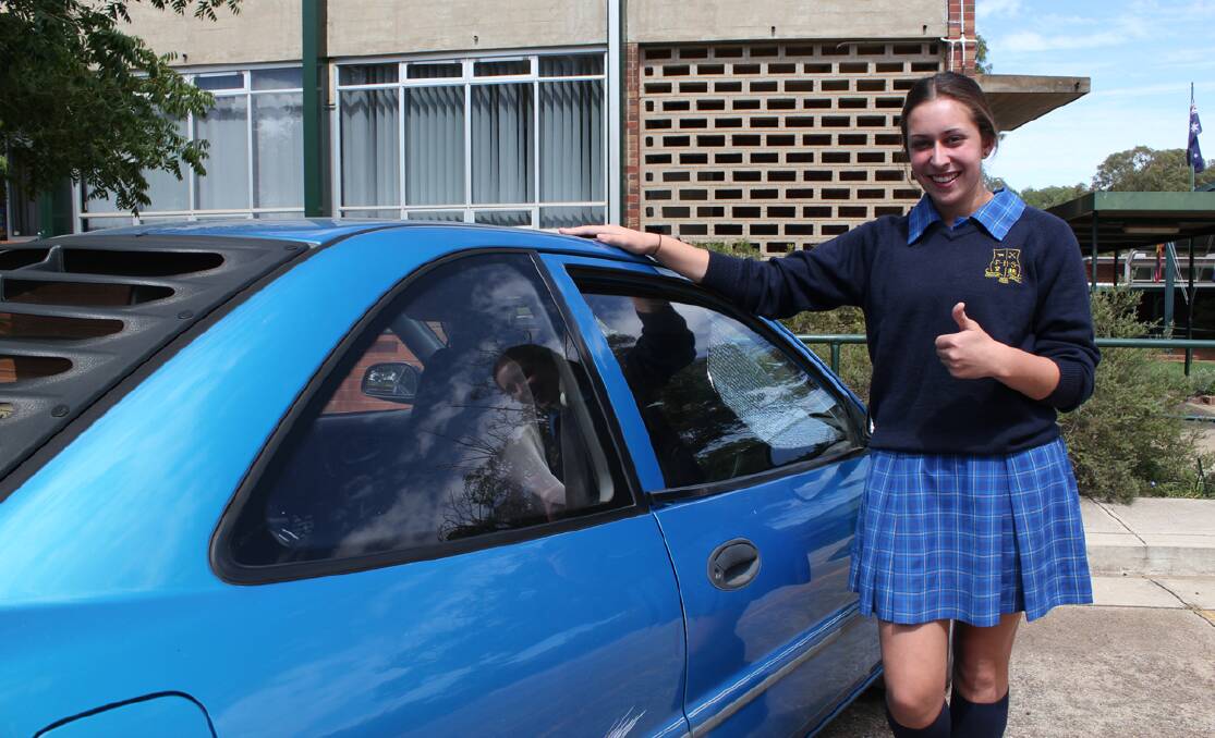 Carly Morrison gives the idea of getting her learner's permit the thumbs up.