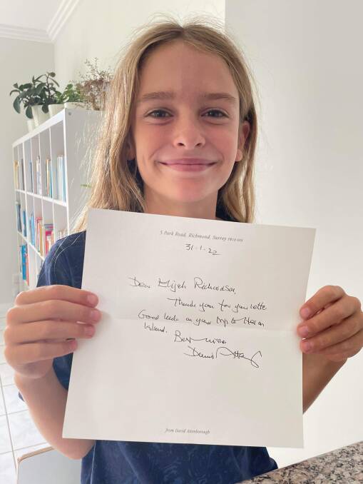 Elijah smiles with his letter from Sir David Attenborough, who is his biggest inspiration when it comes to conservation. Photo: Kerry Richardson.