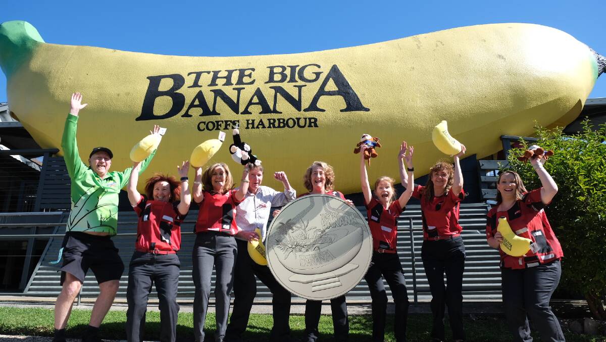 Locals celebrate the commemorative coin in front of The Big Banana in Coffs Harbour. Picture supplied