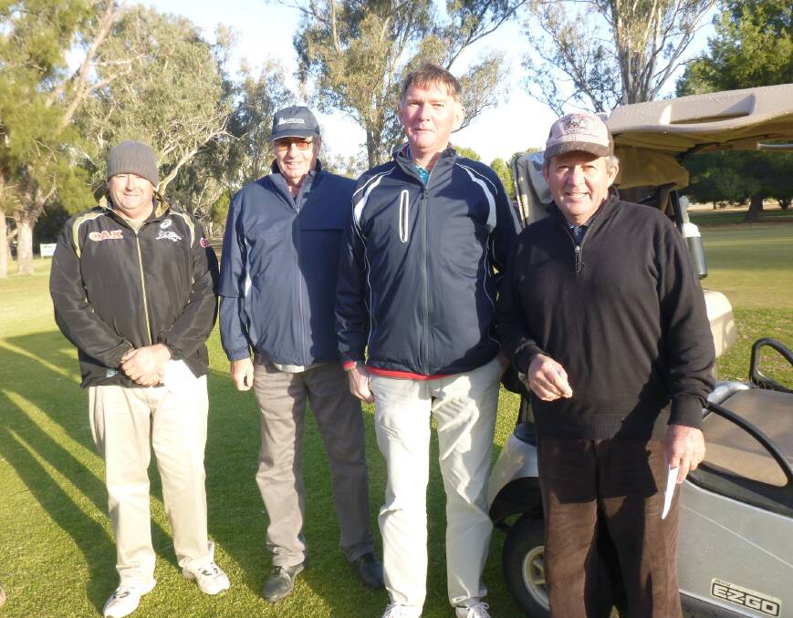 Rugged Up: Peter Cowhan, Greg Webb, Geoff Betland and Brian Doyle dressed to combat the cold weather.