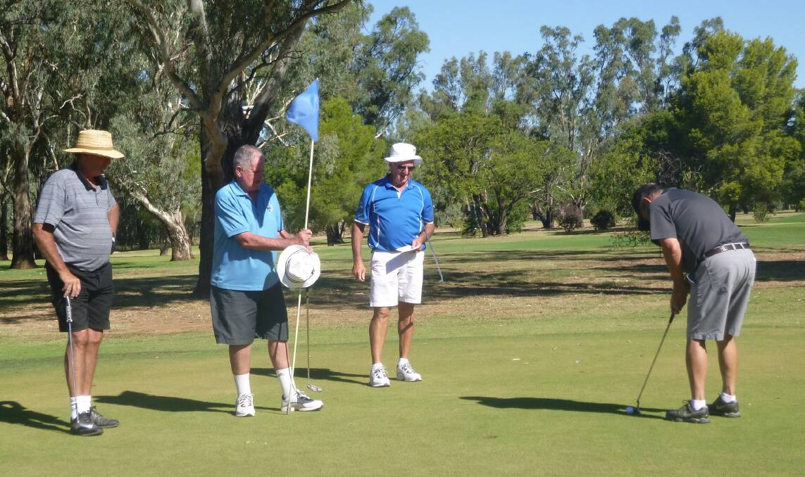 The Fabulous Four: shows Greg Webb, Rod Besgrove and Digit McAuliffe watching Brian Doyle attempt an important putt.
