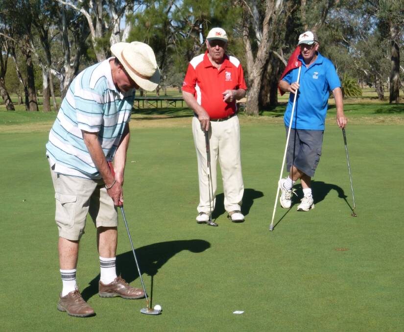 Graham Newport concentrating on his putt while Alby Callaghan and Bruce Chandler watch on. October 28 is an 18-hole Stroke sponsored by The Manna Group, with the Rotary Charity Day on October 29. 