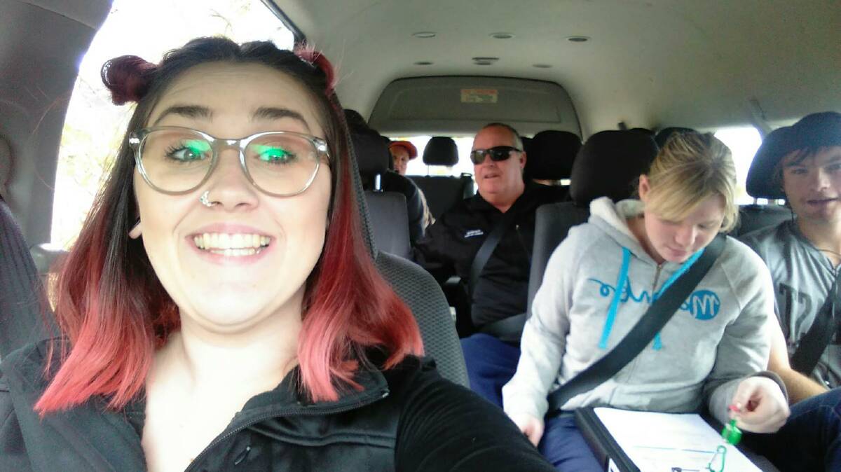 Carers Trilbie Bermingham and Ian O’Brien (back) with Currajong Disability Services clients Ashley Stronach and Jamie Cook on a bus ride. 