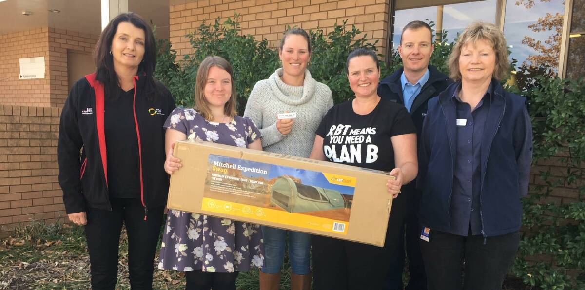 GREAT PRIZE: Amanda Kelly, Lauren Cook, Belinda Crain, Melanie Suitor, Senior Constable Daniel Greef and Anne Bosma with the swag. Photo: Supplied.