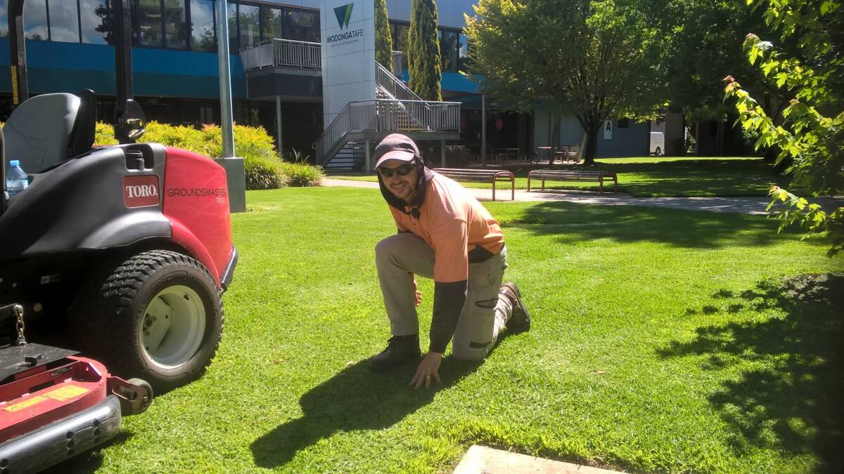 KEEP IT GREEN: Turf apprentice Luke Giles ... understanding lawn care can help your lawn looking good at home too.