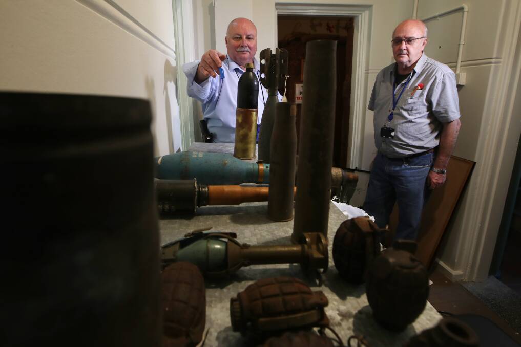 Wollongong Heritage Collections president Terry Bugg told Sgt Gary Keevers about the explosives during an inspection. Picture: Sylvia Liber