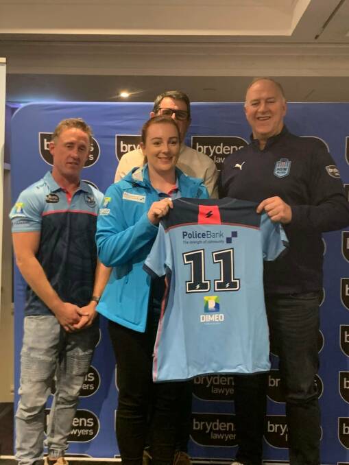ONWARDS AND UPWARDS: Maggie Townsend accepts her NSW playing shirt for the Queensland clash, her performance has earned her selection in the Australian squad. Picture: NSW POLICE RUGBY LEAGUE FACEBOOK