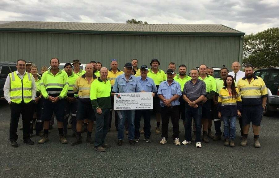 Council staff including John Zannes and Steve Loane presenting proceeds of the event to Norm Haley, Peter Norris, Ian Partington and Ray New. 