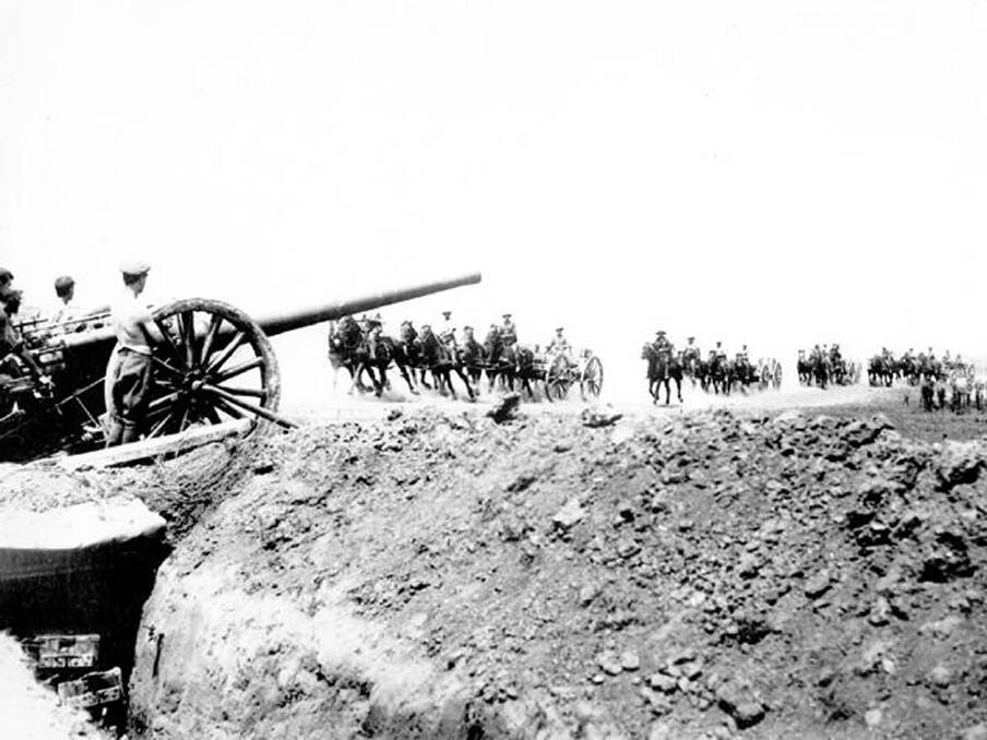 Australian transports passing British field guns, ‘Sausage Valley’, Pozières, June 1916.