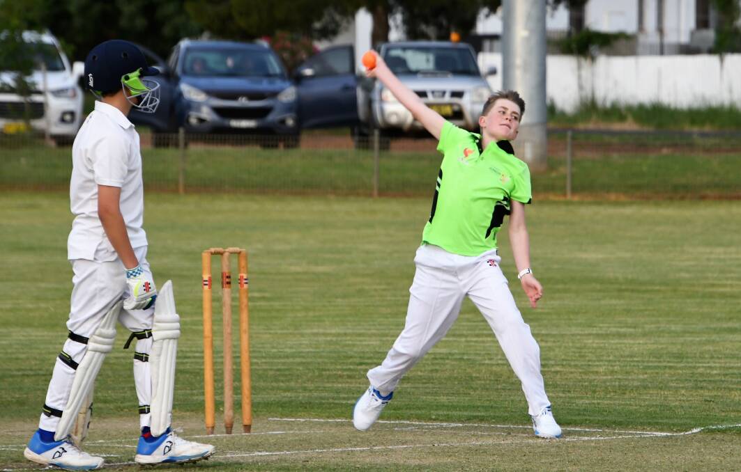 Tom Glasson bowls for Forbes' Under 14s Adept Plumbing side in their contest against Parkes Raptors.