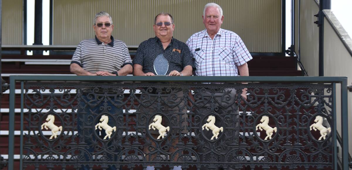 NOMINEE: Harvey Elliott (centre) with Forbes Jockey Club vice president Tom Molloy, and president John Rennick in the restored historic grandstand at the Forbes racecourse.