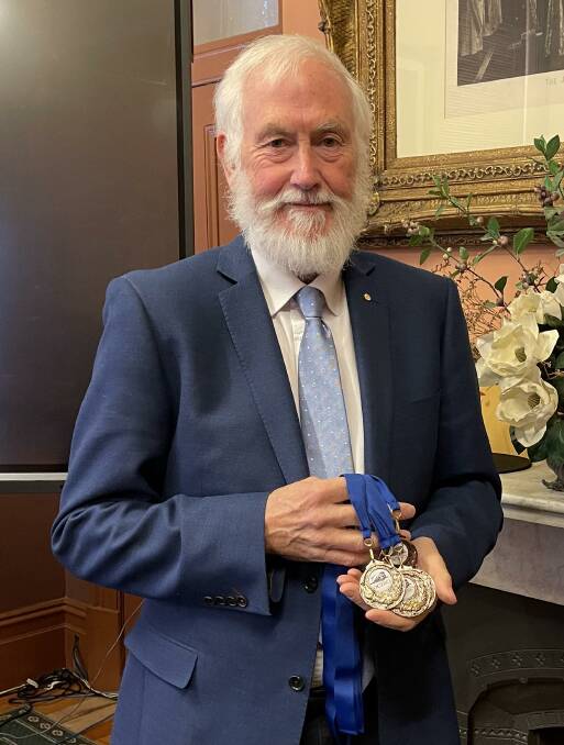 Andrew McDougall OAM with the medals OCTEC is supplying for participants in the 40th anniversary Special Sports Day.