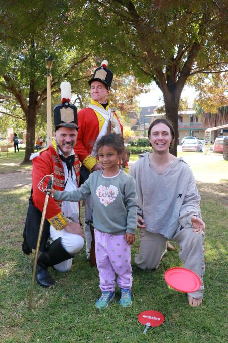 Little Shanelle Colvin with the Convict Footprints team at Forbes' 2021 heritage celebrations in Victoria Park. Weather permitting, the festival returns Saturday.