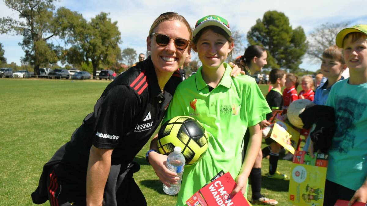 Naomi Klingner was keen to get her soccer ball signed by Wanderers' Kaylie Collins. 