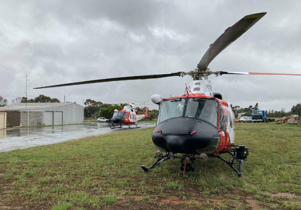 RFS helicopters and Mid Lachlan Valley Team aviation rescue crewmen Mick Cantwell and Tim Perry are on standby for flood rescue and reconnaissance.