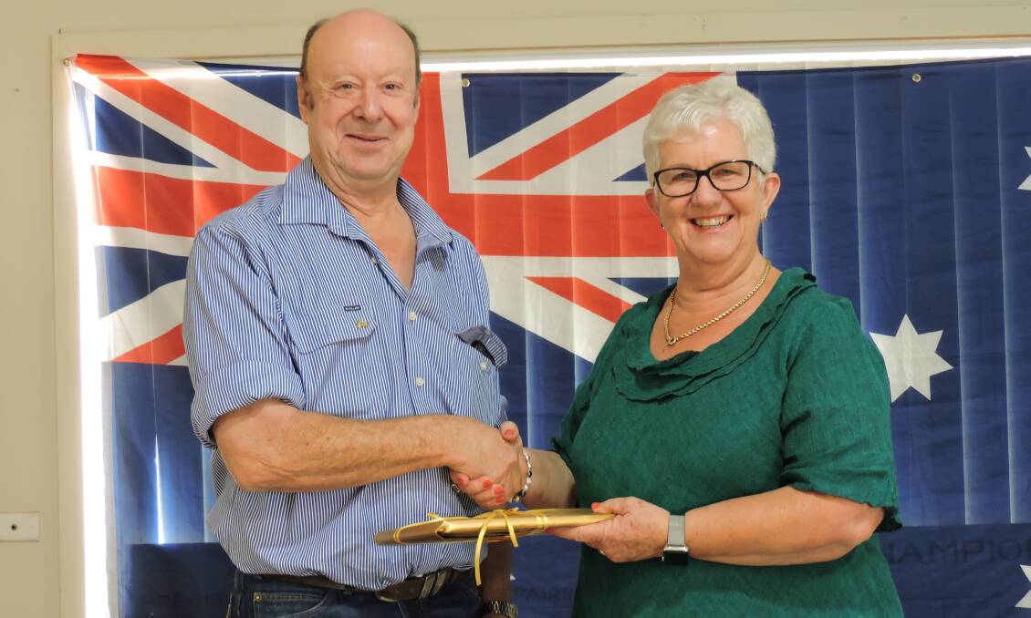Jack Barnes presented a 'thank you' gift to Eugowra's Australia Day guest speaker Janet Moxey who shared the history of the dairying family.