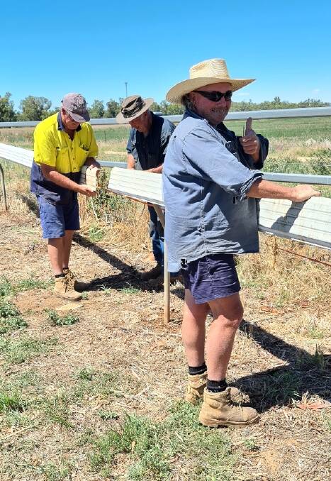 Tom Simmonds and volunteers putting in a new running rail at the Bedgerabong track in January. All's set for a great picnic meeting this Saturday.