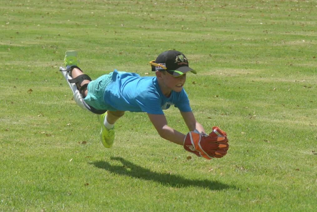 George Field dives to make a catch in the 2017 Super 8s Saturday competition.