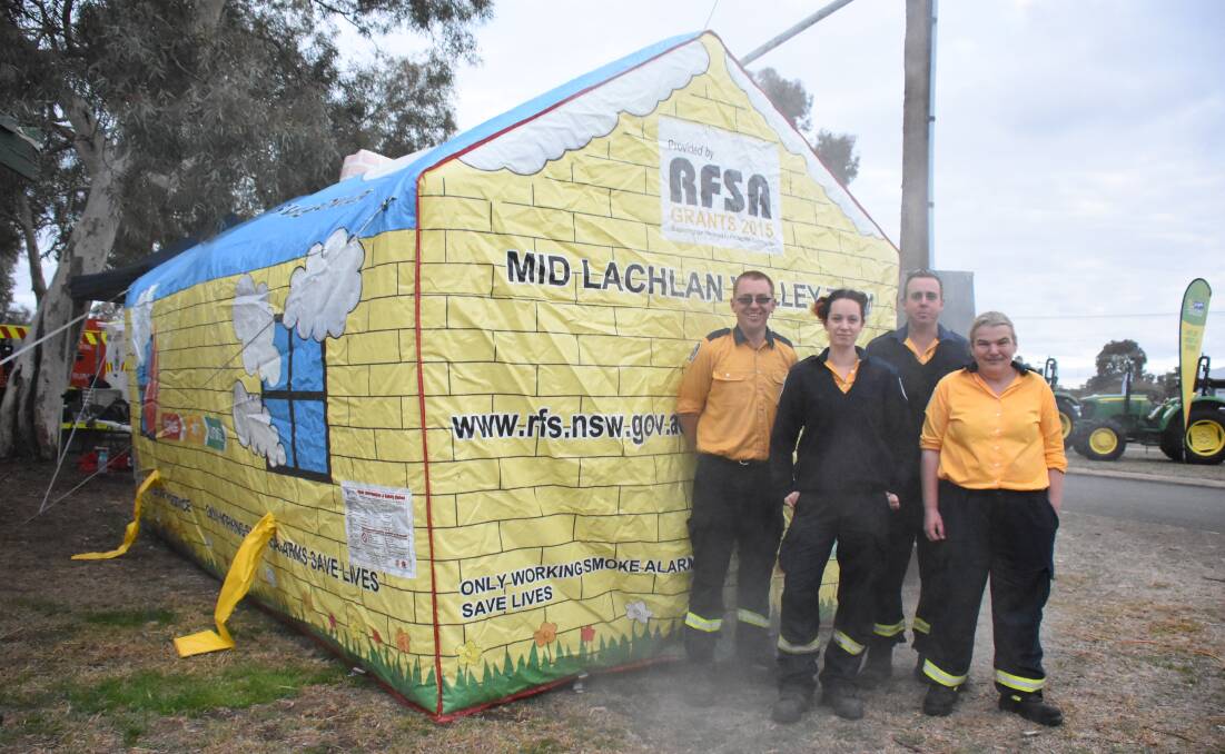Rural Fire Service volunteers Tim Perry, Emma Gamble, Mick Cantwell and Melinda Hayes used their "smoke house" to talk to people about fire safety. You can find out more at their "get ready" day at Forbes Bunnings on September 22.