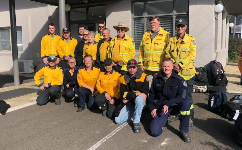 RFS Commissioner Shane Fitzsimmons shared this photo thanking western region volunteers, including Forbes' Beth Dalton (back row fifth from left) and Parkes' Jesse Humphries (front, second from right) for their work at the enormous Bees Nest fire.