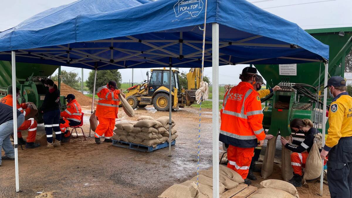 Ready to respond: emergency services filling sandbags as flood warning issued