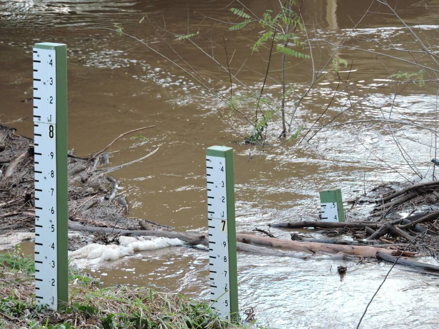 The water in Mandagery Creek on its way to a 6.4m peak at the Eugowra bridge on Tuesday afternoon.