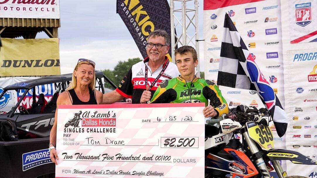 STEPPING UP: Tom Drane accepts his Dash for Cash winner's cheque at the American Flat Track. Picture: SUPPLIED