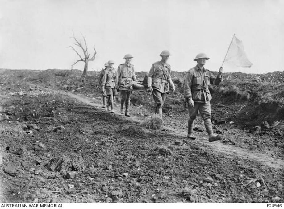 Australian stretcher bearers coming in under a white flag, passing the old cemetery of Pozieres, having come from the line near Mouquet Farm. At this point Tramway Trench crossed Brind's Cut.