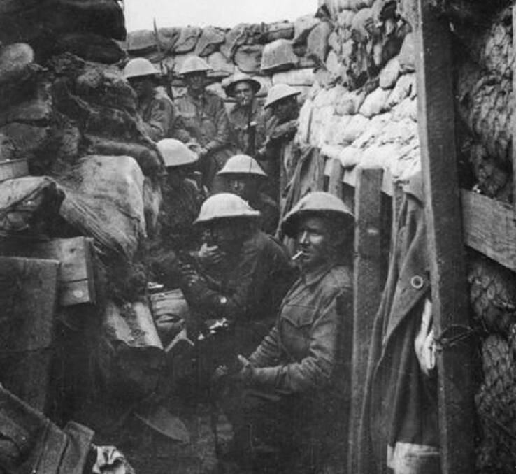 53rd Battalion waiting to don their equipment for the attack at Fromelles. Photo Australian War Memorial.