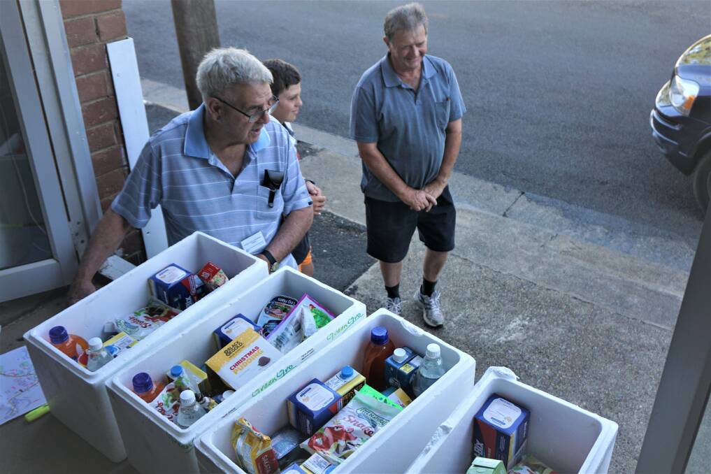 Last year Vince Toohey, Billy Reid and Peter Mackay were loading the hampers into the delivery cars.