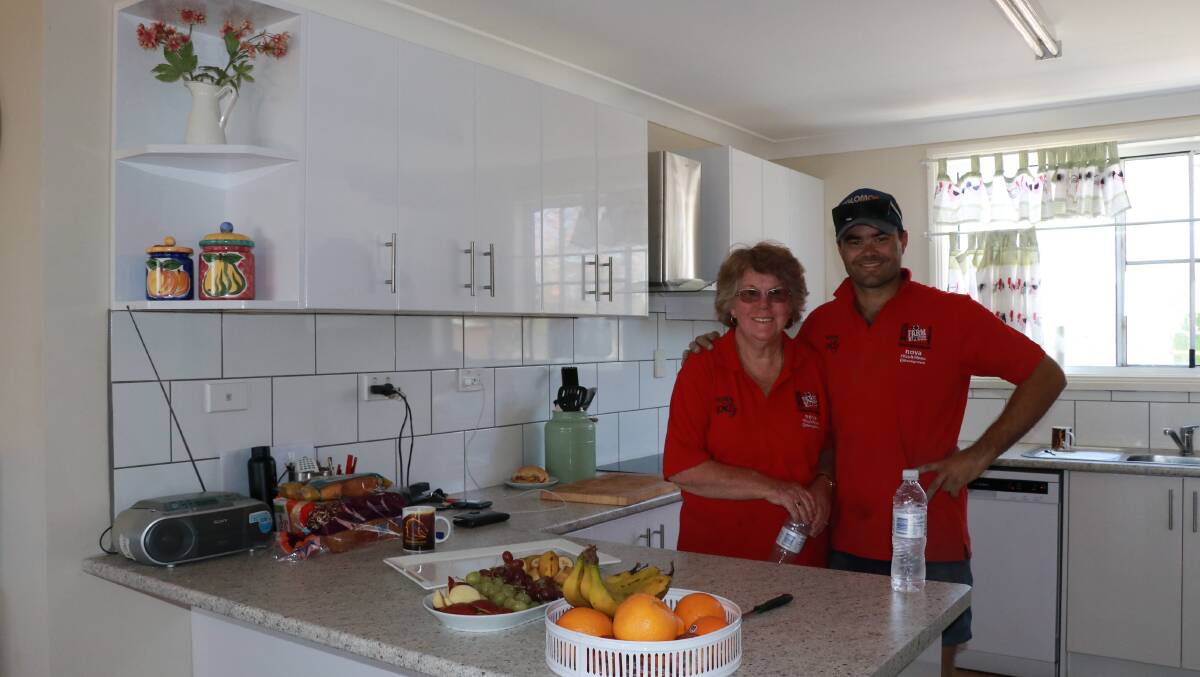 Mark Rayner in his renovated kitchen with volunteer Shirley, who came all the way from Queensland. 