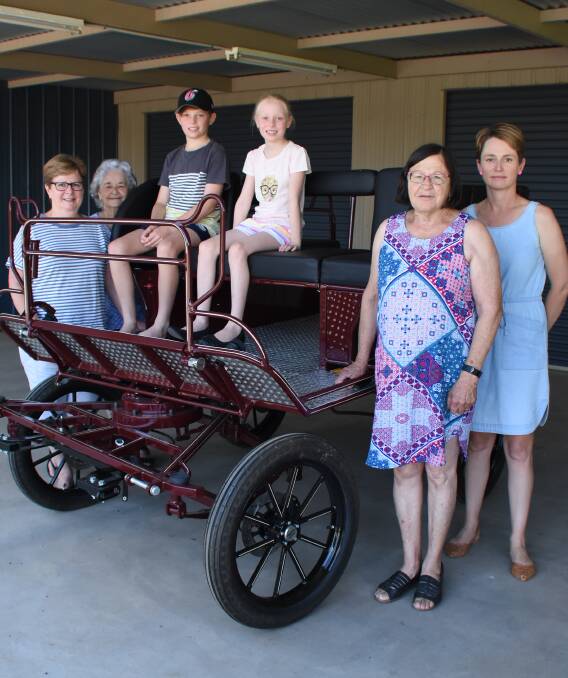 Deb Roylance, Veva MacCullagh, Patrick and Emily Ryan, Mary Hodges and Kylie Ryan with the new wheelchair-friendly buggy.