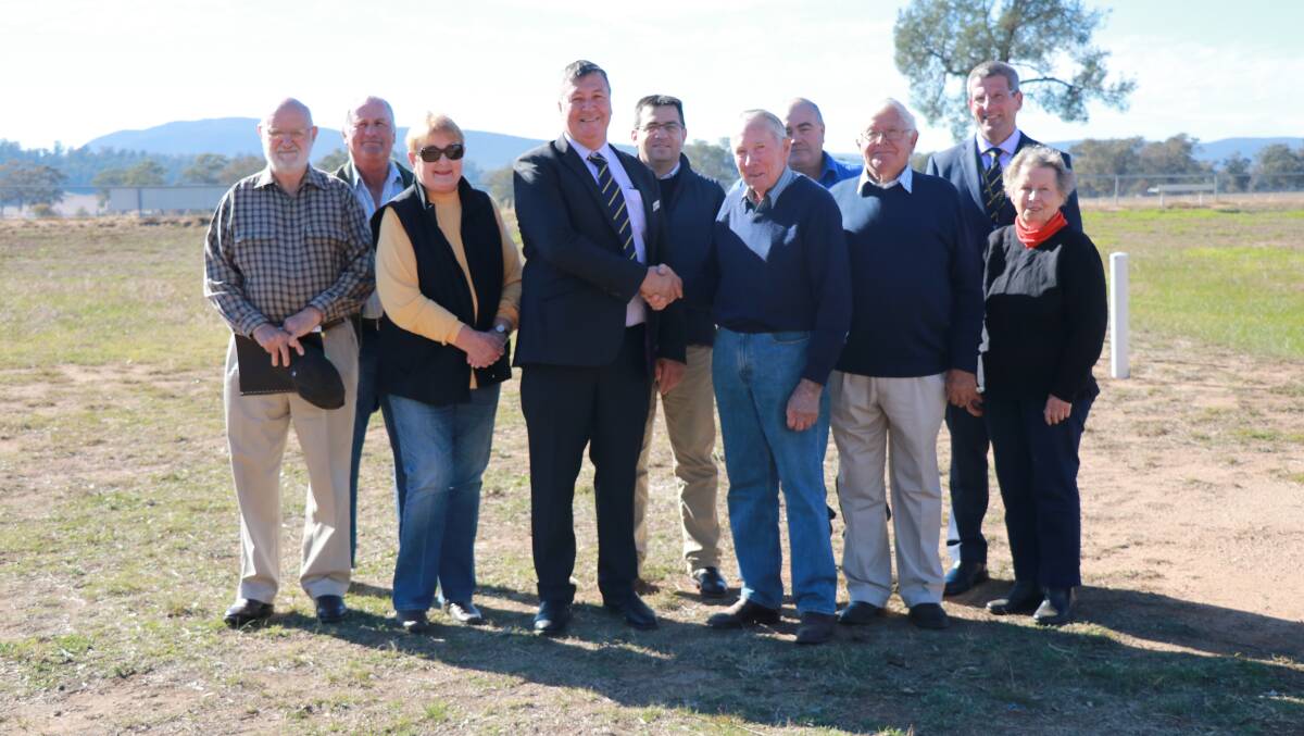 Bob Roach, Ray Agustin, Judy Smith, Mayor Kevin Beatty, Sean Haynes, Bruce Noble, Kevin Townsend, Max Swift, Council General Manager Brad Byrnes and Janet Noble celebrating the $2.3 million announcement at Eugowra Showground on Tuesday.